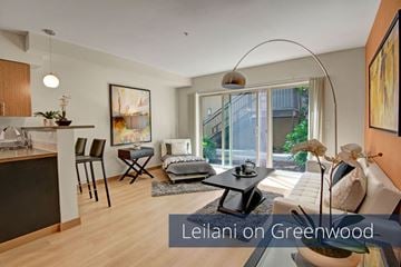 Seattle apartment for rent - A living room with a dining table and chairs.