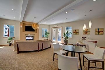Kirkland apartment for rent - A living room with a large couch and a television.