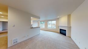 Everett apartment for rent - A large, empty room with a fireplace and a window.
