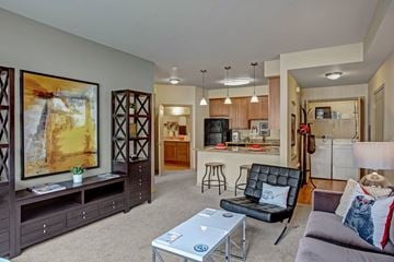 Wenatchee apartment for rent - A living room with a black leather chair and a coffee table.