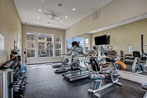 Wenatchee apartment for rent - A spacious gym with treadmills, elliptical machines, and other exercise equipment.
