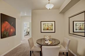 Moses Lake apartment for rent - A dining room with a table set for two and a painting on the wall.
