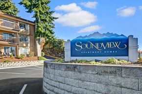 Federal Way apartment for rent - A sign for Soundview Apartment Homes in front of a building.