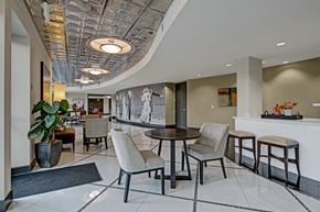 Shoreline apartment for rent - A modern dining room with a round table and chairs.