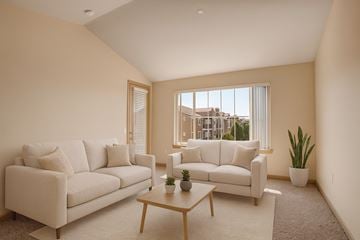 Moses Lake apartment for rent - A living room with two white couches and a coffee table.
