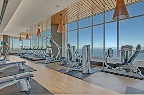 Seattle apartment for rent - A gym with a view of the city skyline.