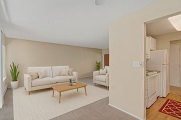 Lake Forest Park apartment for rent - A living room with a white couch and a wooden coffee table.