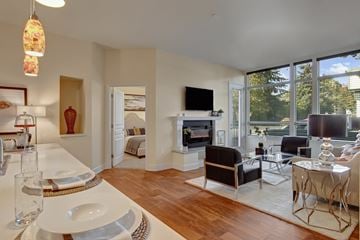 Woodinville apartment for rent - A modern living room with a dining table set for two.