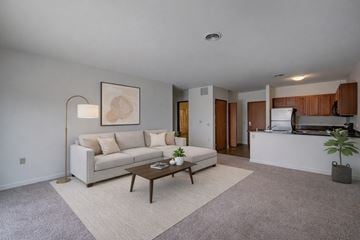 Milwaukee apartment for rent - A living room with a white couch and a coffee table.