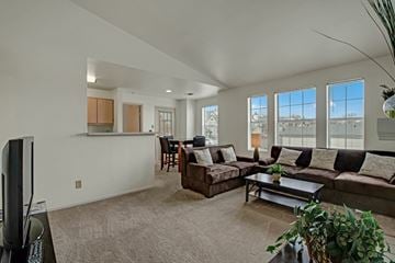 Milwaukee apartment for rent - A living room with a brown couch and a television.