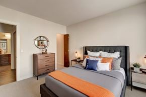 Milwaukee apartment for rent - A bedroom with a large bed and a dresser.