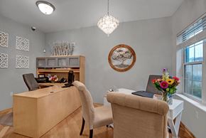 Fitchburg apartment for rent - A kitchen with black appliances and wooden cabinets.