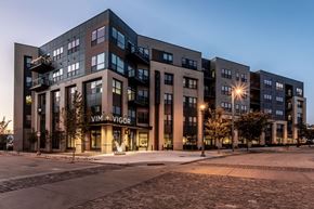 Milwaukee apartment for rent - A modern apartment building with the name VIM + VIGOR on the front.