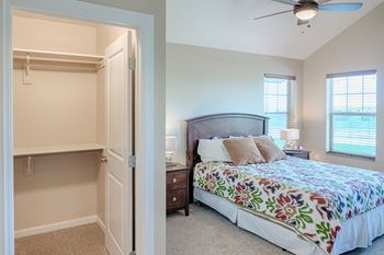 Master bedroom with cathedral ceilings and walk-in-closets