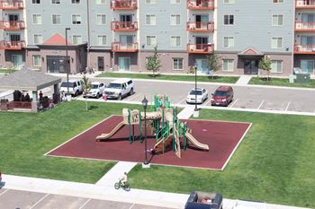 Community area with bbq grilling stations and playground