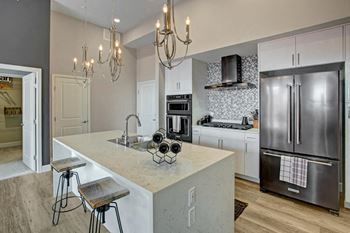 Variety of interior finishes with black, white, or stainless steel kitchen appliances