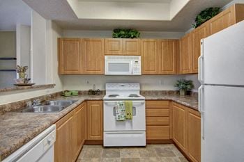 Arezzo apartments- large kitchen with wooden cabinets 