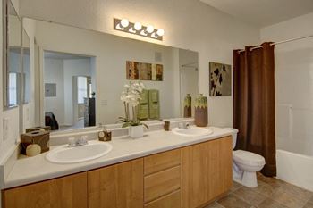 Arezzo apartments- spacious bathroom with twin sinks and mirrors 