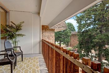 Copper stone balcony with chairs