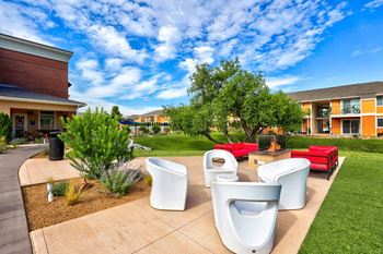 Outdoor fireplace with lounge seating