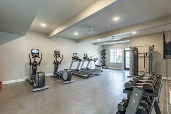24-Hour fitness center with rock climbing wall