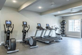 24-Hour fitness center with rock climbing wall