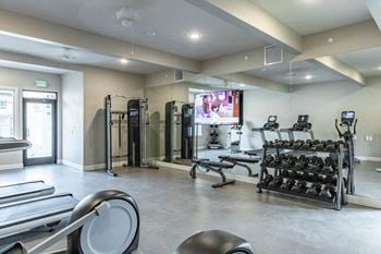 24-Hour fitness center with rock climbing wall