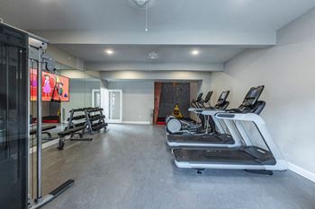 24-Hour fitness center with rock climbing wall