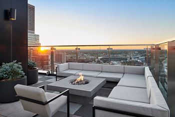 Outdoor dining with weber gas grills and sundeck with lounge and fire pits