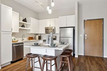 Modern cabinetry with designer hardware and tile backsplashes