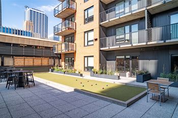Outdoor game space with lawn bowling
