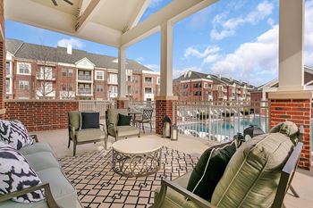 Sundeck with lounges, covered patio seating, and cabana seating