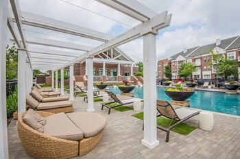 Sundeck with lounges, covered patio seating, and cabana seating