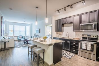 Quartz countertops and tile backsplash