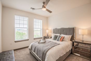 Bedrooms with ceiling fans and spacious closets