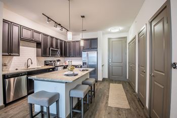Gourmet kitchen island with pendant lighting
