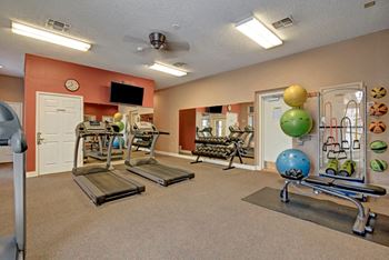 St. James place fitness center with cardio equipment and weights