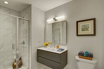 Bathrooms include marble tile and designer fixtures and finishes