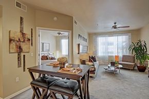 Peoria apartment for rent - A dining room with a wooden table and chairs.