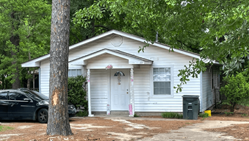 Ruston apartment for rent - a white house with a car parked in front of it