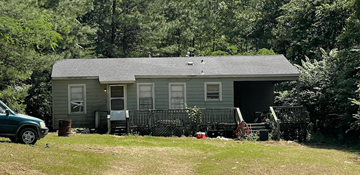 Ruston apartment for rent - a house with a yard and a car in front of it