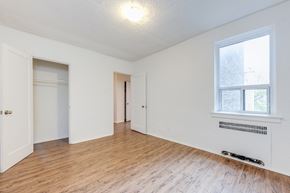 York apartment for rent - Empty room with a window and radiator.