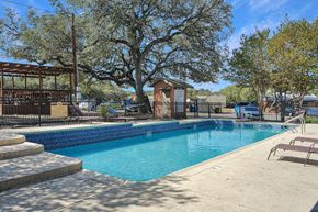 San Antonio apartment for rent - Modern swimming pool with lounge seating at Sierra Ranch Apartments in San Antonio, TX.