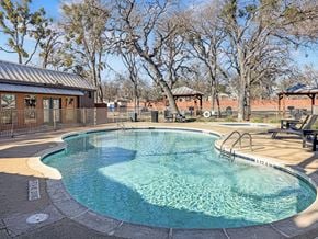 Hurst apartment for rent - Swimming pool with lounge chairs and landscaping at Verano Oaks Apartments