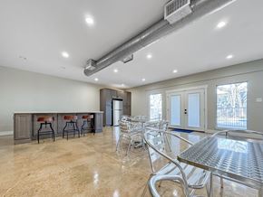 Hurst apartment for rent - Clubhouse seating area with modern décor and polished flooring