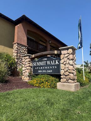Ontario apartment for rent - A sign for Summit Walk Apartments is in front of a building.