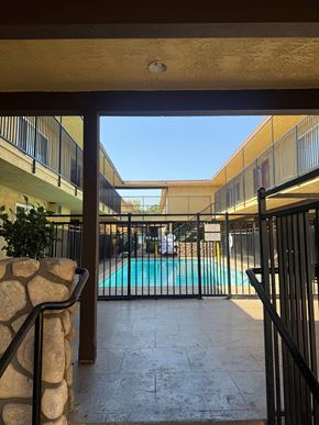 Ontario apartment for rent - A pool is seen through a gate.