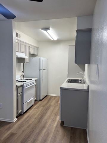Ontario apartment for rent - A small kitchen with a stove and a sink.