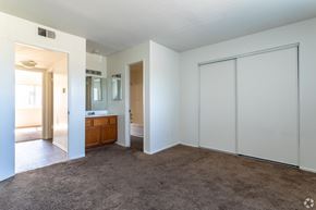 Ontario apartment for rent - A room with a brown carpet and white walls.