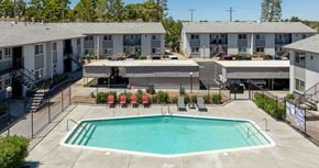 Victorville apartment for rent - A swimming pool in front of apartment buildings.